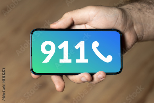 911 - hand holding a phone