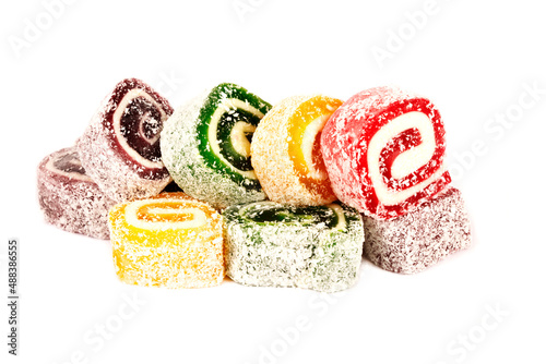 Heap of colorful Turkish delight isolated on white background. Turkish sweets isolated on white background. Ramadan.