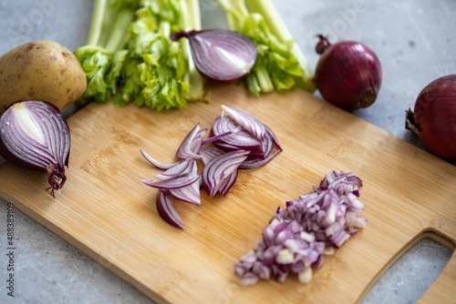 Red onion. Vegetable soup preparation. Sliced ​​red onion into half rings. 
Diced red onion.