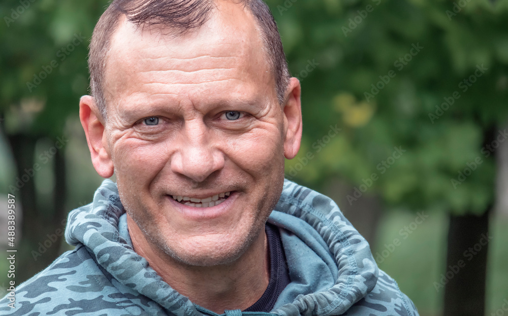 close-up of a handsome middle-aged european man against the backdrop of nature close-up of a handsome middle-aged european man against the backdrop of nature