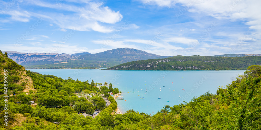 Panorama of the Lake of Sainte-Croix and its surrounding mountains on a summer day in the Verdon valley, France