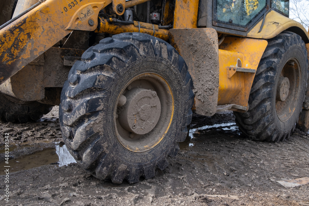 Close photo of construction bulldozer whell Close photo of construction bulldozer whell