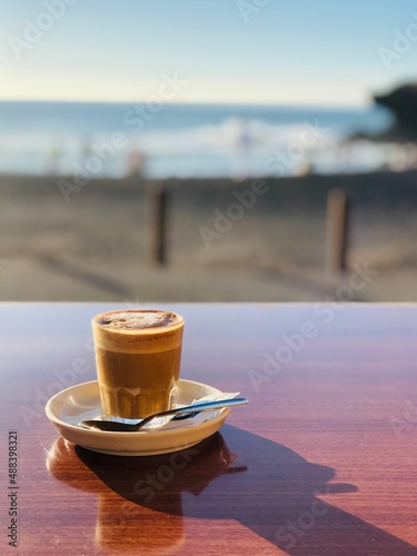 Cup of coffee on the beach. Cortado in bar, Spain