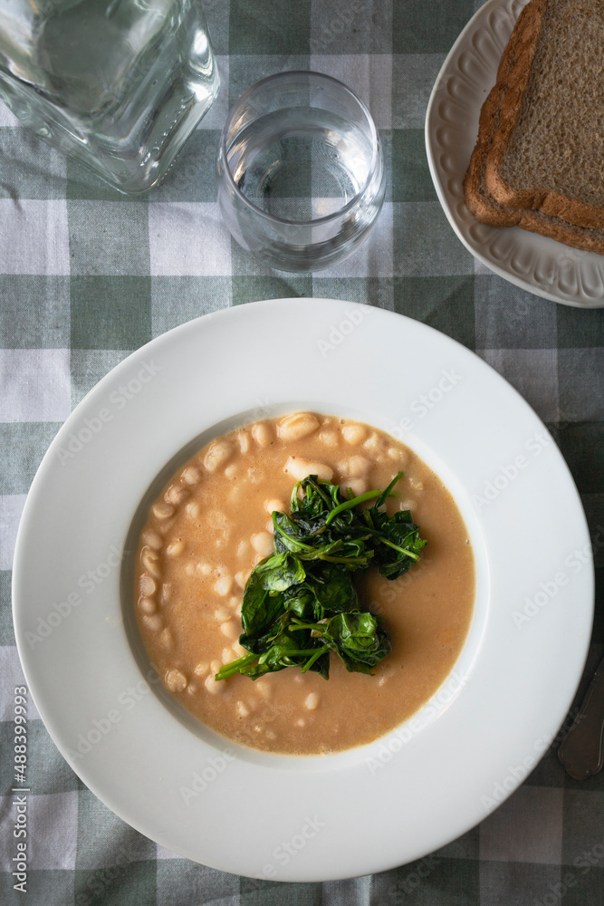 White beans with spinach. Healthy dish with vegan protein. White beans with spinach. Healthy dish with vegan protein.