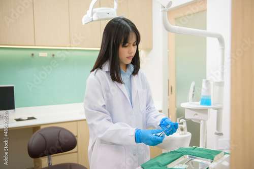 Portrait of female dentist working in dental clinic  teeth check-up and Healthy teeth concept