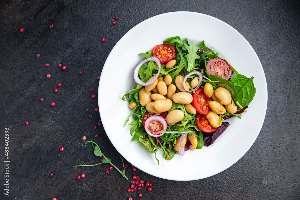 salad white beans, tomato, leaves lettuce mix petals fresh portion healthy meal food diet snack on the table copy space food background keto or paleo diet veggie vegan or vegetarian food no meat salad white beans, tomato, leaves lettuce mix petals fresh portion healthy meal food diet snack on the table copy space food background keto or paleo diet veggie vegan or vegetarian food no meat