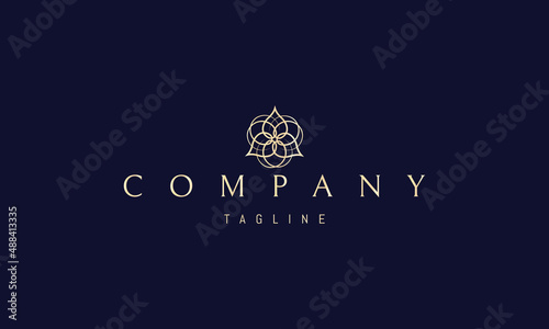 Vector golden logo on which an abstract image of a trinity symbol in the form of a flower.