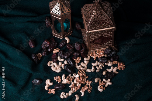 Ramadan and Eid al fitr Background 2021 special Islamic photos, new colorful Ramadan Mubarak isolated with blue background Arabic light lamp with dates,cashews,walnuts etc. iftar concept imag