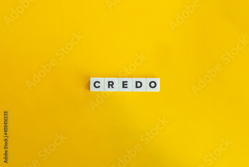 Credo Word on Letter Tiles on Yellow Background. Minimal Aesthetics. photo