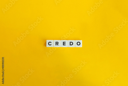 Credo Word on Letter Tiles on Yellow Background. Minimal Aesthetics.
