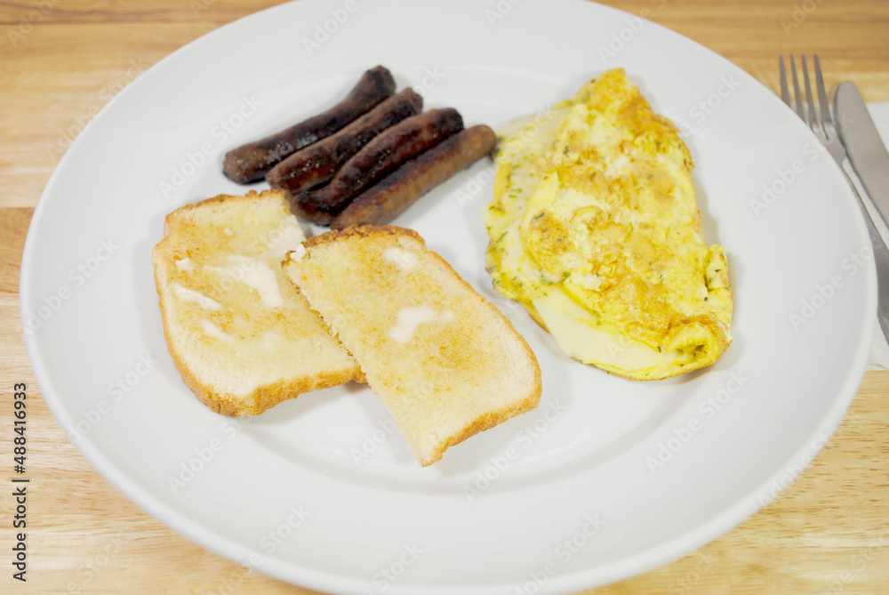 An Cheese Omelet with a side of White Toast and Sausages
