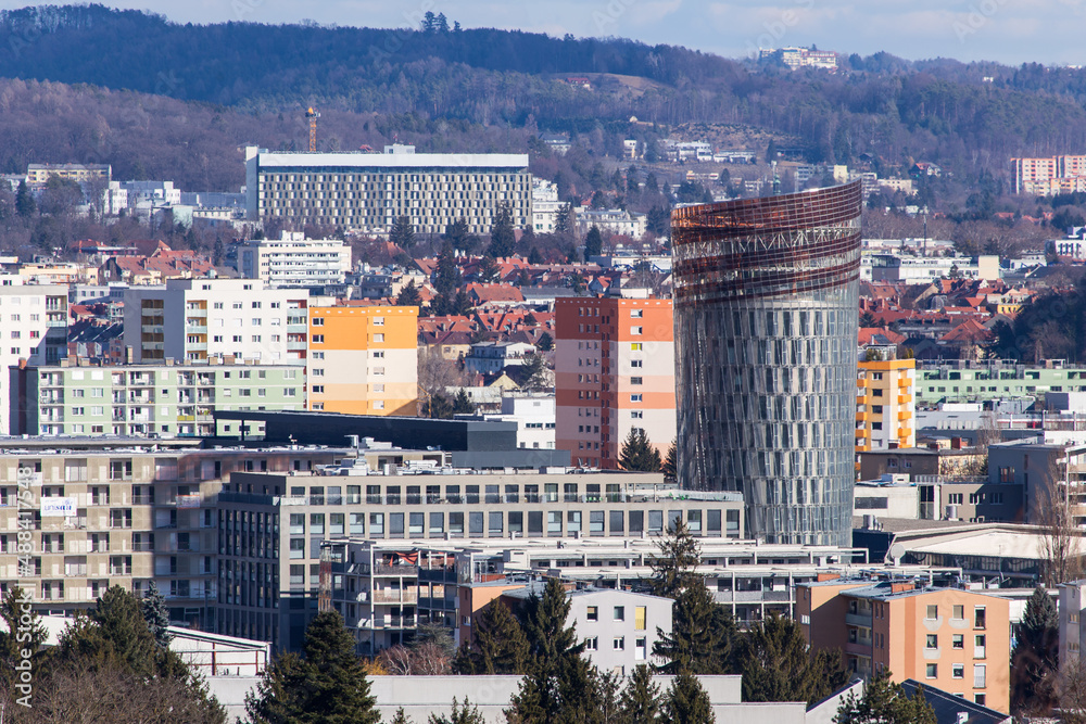View over the skyline of Graz during Winter with the Smart Tower in the new city development area Smart City in the foreground 