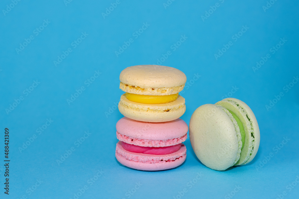 Macaroni with sweet almonds or dessert cake made of almond cookies, painted in the fashionable color of 2022. Very beautiful background. Macaroni with sweet almonds or dessert cake made of almond cookies, painted in the fashionable color of 2022. Very beautiful background.