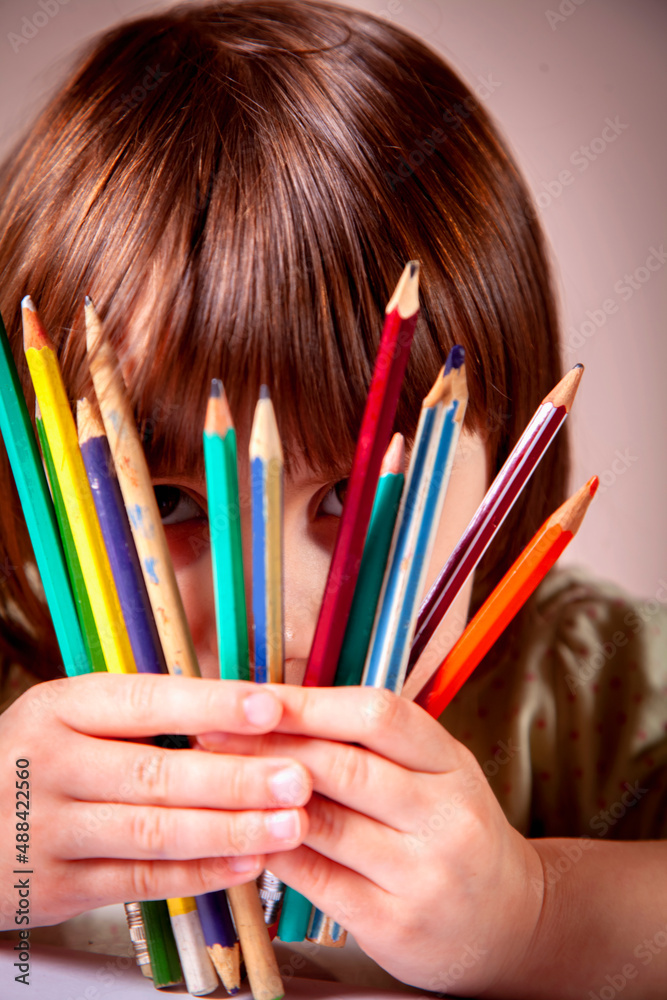 Young beautiful girl with pencils learning to paint. Young beautiful girl with pencils learning to paint.