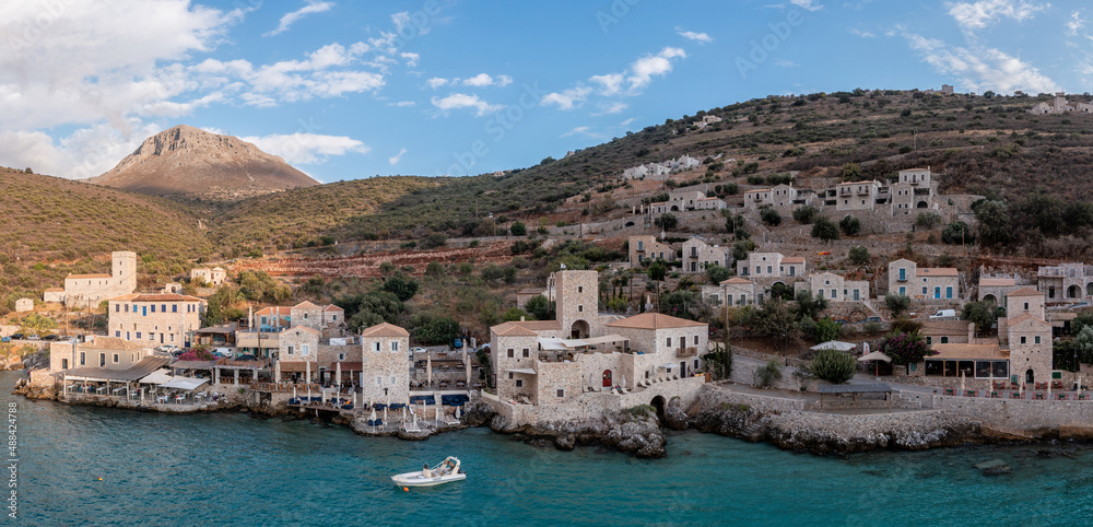 Greece. Limeni port, destination Mani Lakonia, Peloponnese. Building, shop tavern, fishing boat.