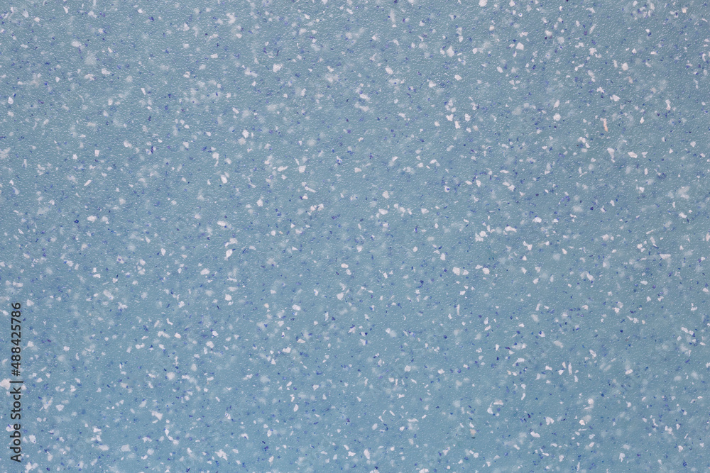 aqua plastic background with white and blue crumbs