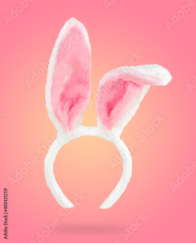 Papier peint Easter bunny ears on pale pink background with soft shadow