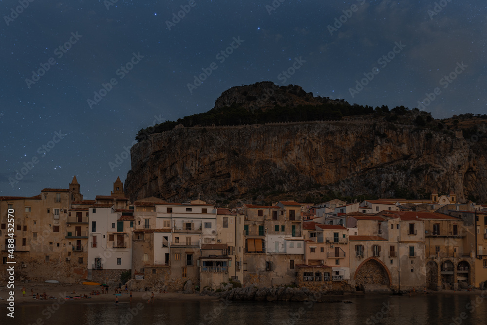 Cefalu at night. Night sky Cefalu, medieval village Sicily, Palermo province, Italy