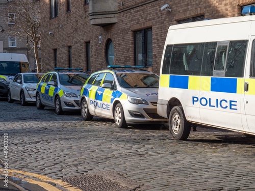 Tablou pe pânză A line of parked police emergency vehicles UK