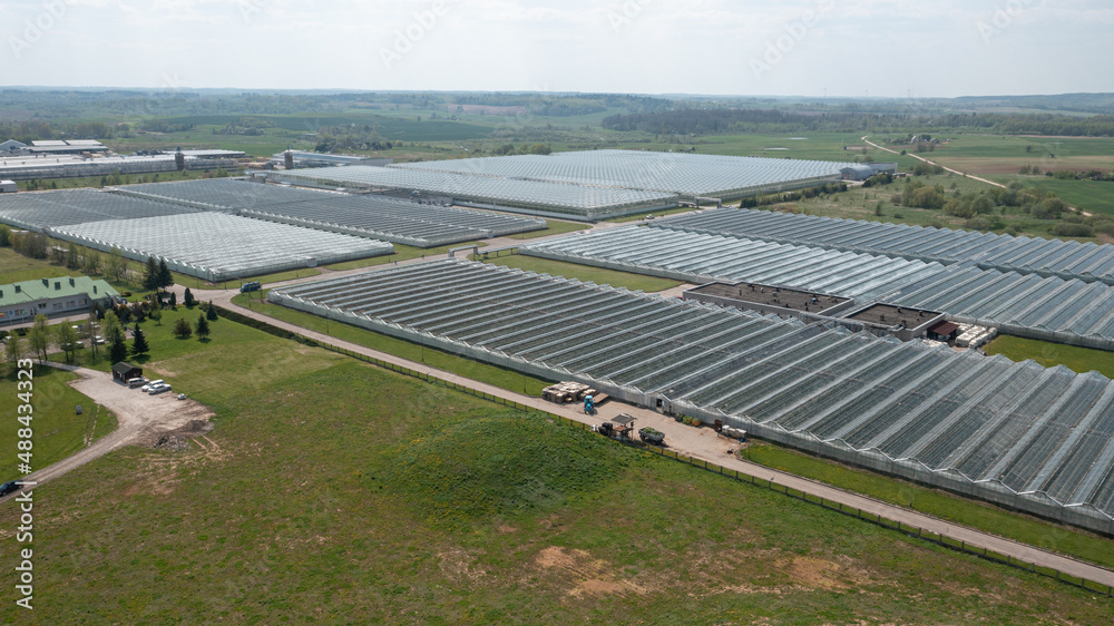 Aerial view on the large Modern Greenhouse in Summer