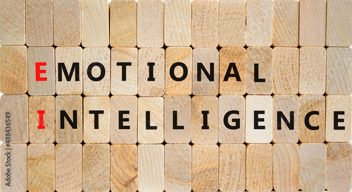 EI emotional intelligence symbol. Concept words EI emotional intelligence on wooden blocks on a beautiful wooden background. Business EI emotional intelligence concept, copy space. photo