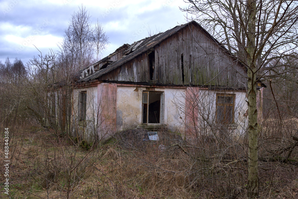 Old abandoned house. Ruined building with collapsing roof. Old abandoned house. Ruined building with collapsing roof.