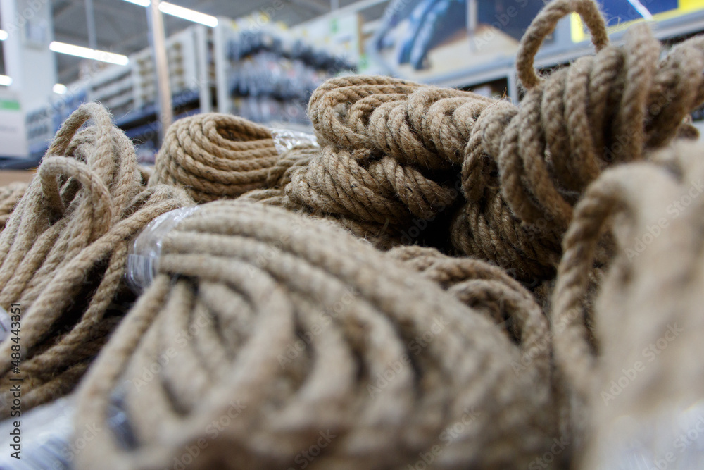 Jute rope, rope made of natural material. Many kits nearby, selective focus.