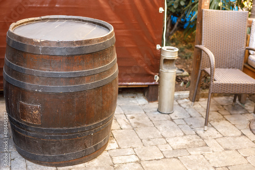 A large wooden barrel tied with metal hoops. © kpn1968