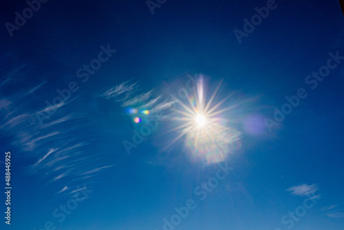 natural landscape background with blue sky  sun and white clouds