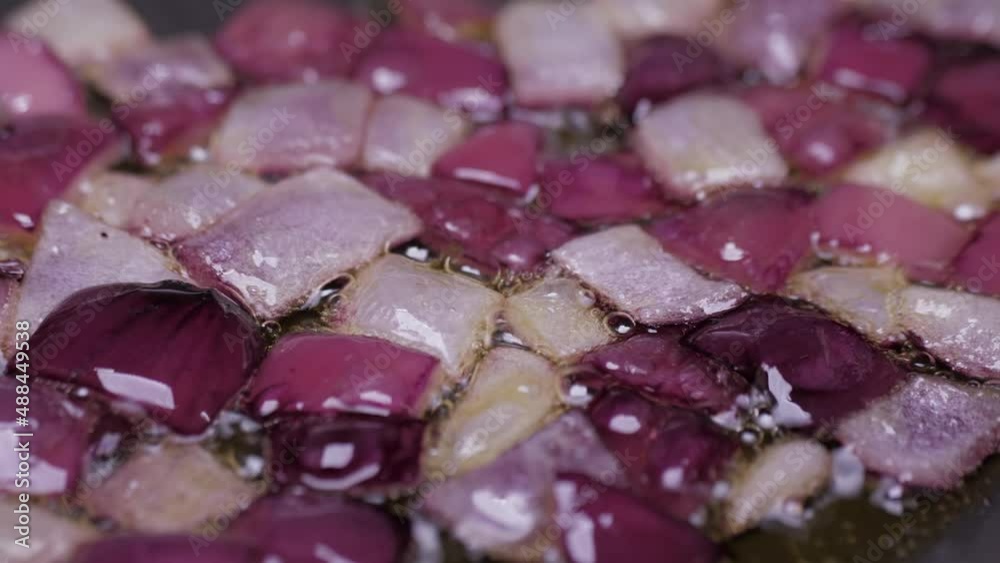 frying chopped onion on fry pan slow motion 4k frying chopped onion on fry pan slow motion 4k