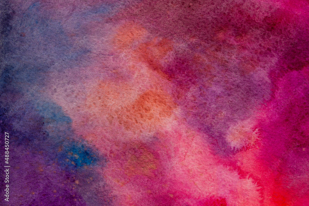 Vibrant purple, blue, pink and red hand painted galactic nebula looking watercolor background.