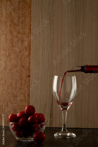 Bottled wine pouring spout serving red wine