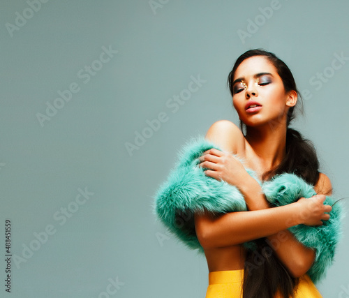 young pretty african-american woman posing in fashion clothers emotional, lifestyle people concept