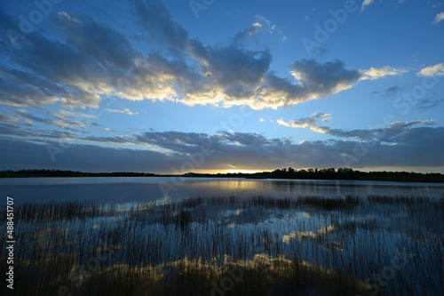 Fototapeta Naklejka Na Ścianę i Meble -  Sunrise cloudscape reflected in tranquil water of Nine Mile Pond in Everglades National Park, Florida.