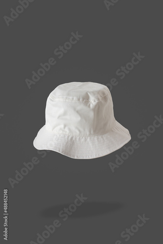 white bucket hat, grey background 