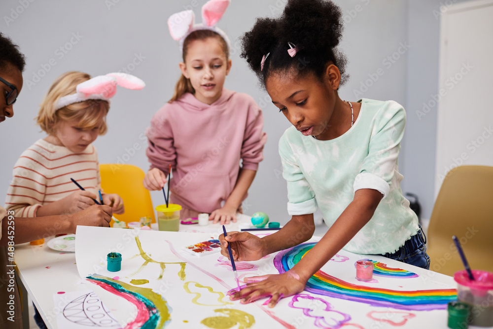 Fotografia Diverse group of kids at art and craft table on easter party for children Seventyfour Kup na Posters.pl