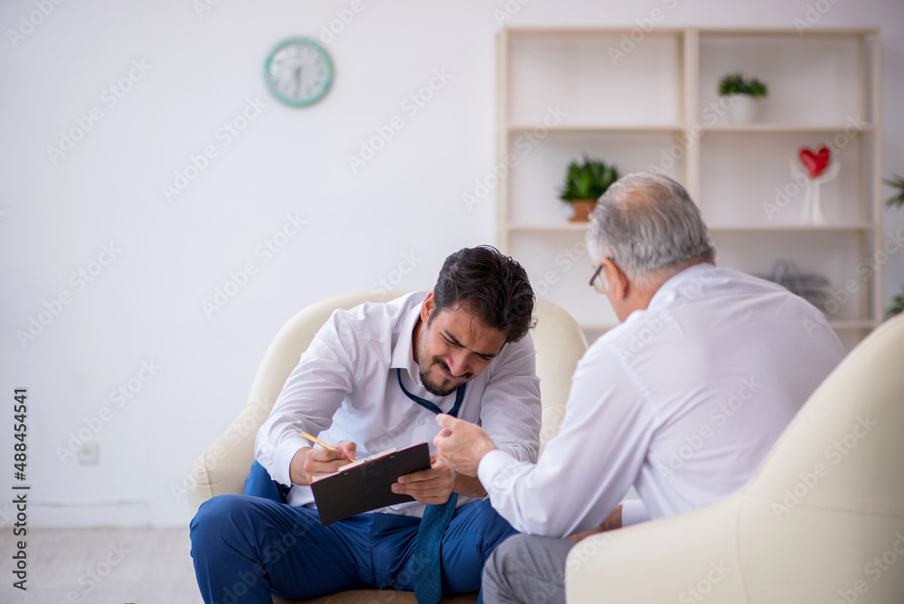 Young businessman employee visiting psychologist Young businessman employee visiting psychologist