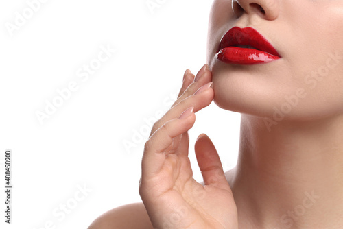 Closeup view of woman with beautiful full lips on white background