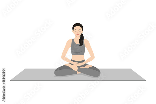 Lotus Pose. Beautiful girl practice Padmasanaa. Young attractive woman practicing yoga exercise. working out, black wearing sportswear, grey pants and top, indoor full length, calmness and relax. photo