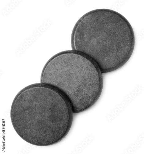 Group of grey stones on white background, top view
