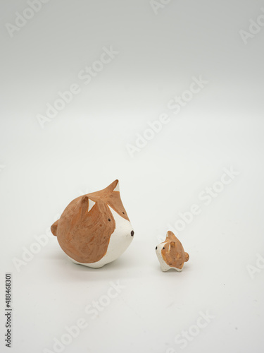 Lovely clay dog on a white background