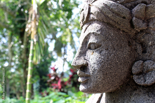 Closeup of Balinese style statues and offering in Ubud.