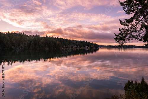 Quadro su tela Vibrantly colorful sunrise reflections on Puget Sound, Washington, Pacific North