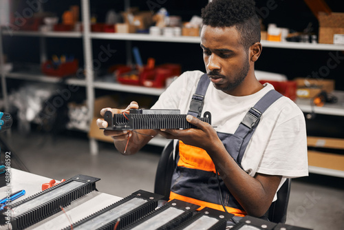 Factory worker doing quality control at the production line