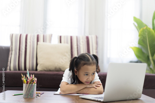 Asian girl thoughtful studying homework online lesson at home, Social distance online education idea concept
