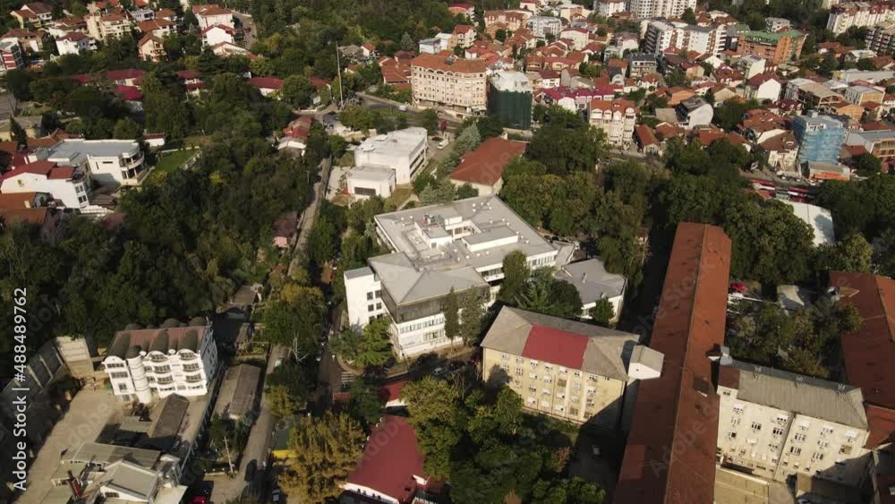 Aerial View of Residential Neighborhood of Skople, North Macedonia, Buildings and Streets on Sunny Summer Morning, Revealing Tilt Up Drone Shot