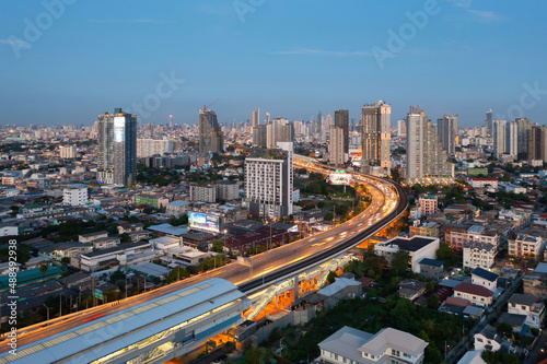 Aerial view of highway street road at Bangkok Downtown Skyline, Thailand. Financial district and business centers in smart urban city in Asia. Skyscraper and high-rise buildings at night. © tampatra