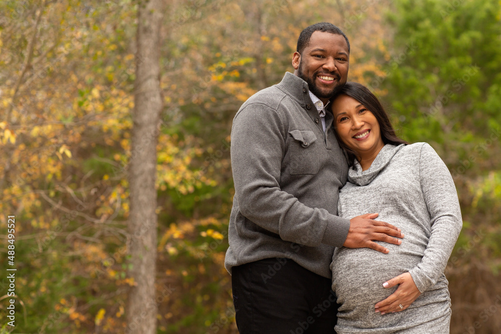 Portrait of a mixed race couple who are expecting parents Portrait of a mixed race couple who are expecting parents