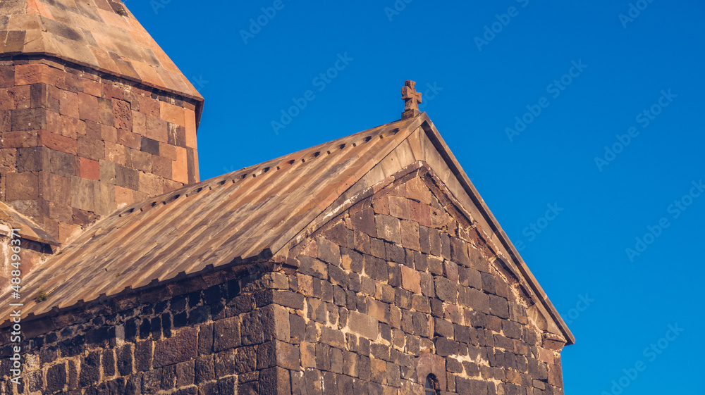 Closeup view of an old Sevanavank church in Sevan. Blue sky and bright autum colors on the sunny day. Ancient temple stock photography. Closeup view of an old Sevanavank church in Sevan. Blue sky and bright autum colors on the sunny day. Ancient temple stock photography.