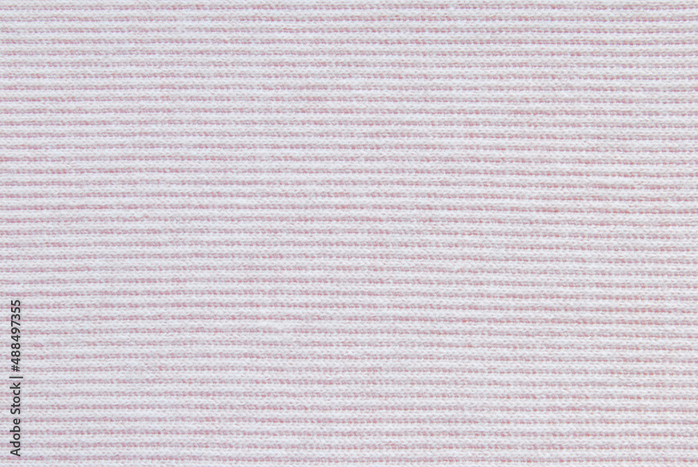 Soft light pink ribbed jersey fabric texture or background Soft light pink ribbed jersey fabric texture or background